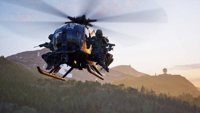 Wardogs squad riding a helicopter over the mountains